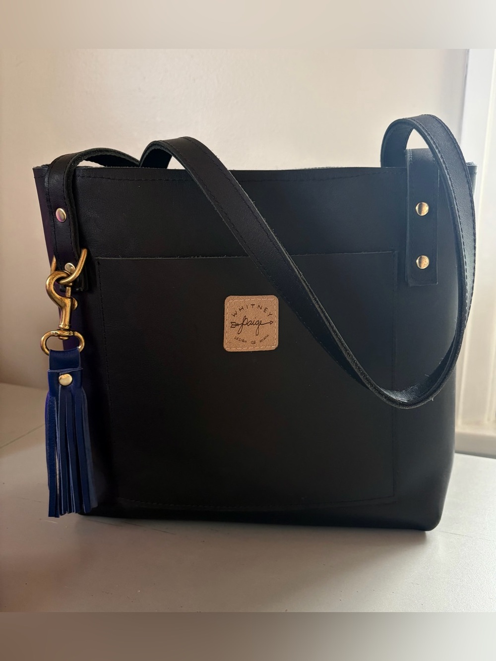 Black Leather Shoulder Tote with cobalt Blue leather Tassel charm